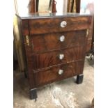 A Biedermeier style European mahogany chest, with marble top above four drawers mounted with