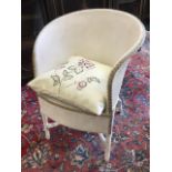 A painted Lloyd Loom style armchair with rounded back above box seat with floral embroidered
