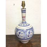 A Spanish tablelamp with tall neck above vase handpainted with frieze of circular duck medallions,