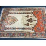 An oriental style prayer rug woven with floral vase in arched niche hung with lanterns, the scrolled