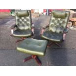 A pair of contemporary button upholstered armchairs with loose cushions having adjustable seats,