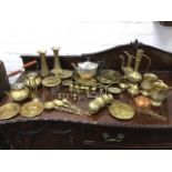 Miscellaneous brass including teapots, vases, tankards, miniature pieces, circular embossed plaques,
