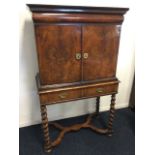 A William & Mary walnut cabinet on stand, having moulded cornice above a cushion moulded frieze