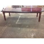 A British Antique Replicas mahogany Victorian style extending dining table, the rectangular