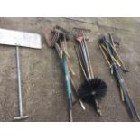 A quantity of garden tools including spades, brushes, shears, edge trimmers, shovels, rakes, a