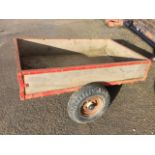 A 4ft rectangular trailer with angle iron frame, the axel with 15in tyres, having flexible hitch. (