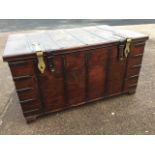 A large hardwood chest, the trunk having interior with hinged candle box above a secret compartment,
