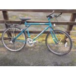 A Karakoram Elite gents bicycle with bullnose handlebars, panier rack, padded seat, Shimano gears,