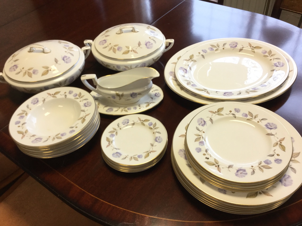 A Royal Worcester dinner service in the Blue Poppy pattern, including tureens & covers, dinner