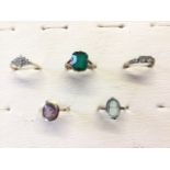 A 9ct gold amethyst ring with oval bezel set stone; and four other 9ct gold rings set with