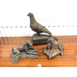 A resin bronze model of a retriever on cushion type base, signed & dated; a faux bronze cast of a