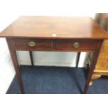 A nineteenth century mahogany side table, the rectangular boxwood strung top above a frieze with two