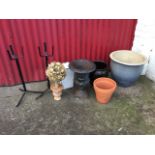 A Victorian style cast iron urn with fluted body mounted with scrolled handles; a large stoneware