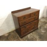 A Victorian mahogany chest of drawers, with rectangular moulded top above two short and three long