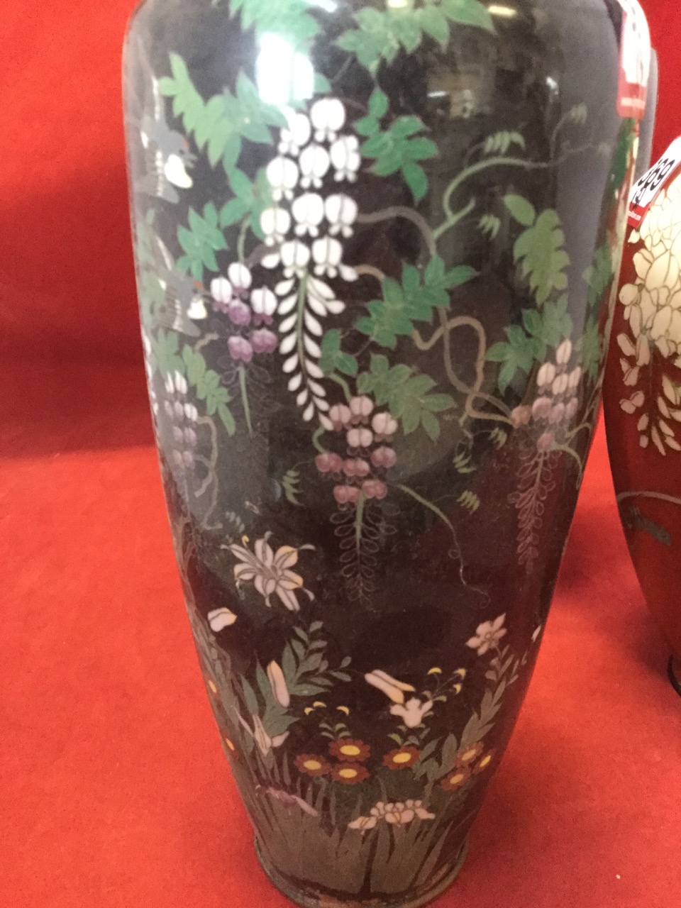 A pair of tapering late Victorian cloisonné vases decorated with birds and trailing foliage on black - Image 2 of 3