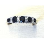 A 9ct gold sapphire & diamond half-eternity ring, the five claw set graduated sapphires in