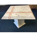 A square faux marble coffee table, the moulded top with decorative bands supported a column with