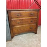 A late Victorian mahogany chest of three long moulded drawers, mounted with later pierced rosette