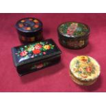 A handpainted rectangular Russian papier-mâché box with signed floral decoration; a circular ivory