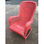 A painted Edwardian verandah armchair, the spoonback with lozenge panel having tapering downswept