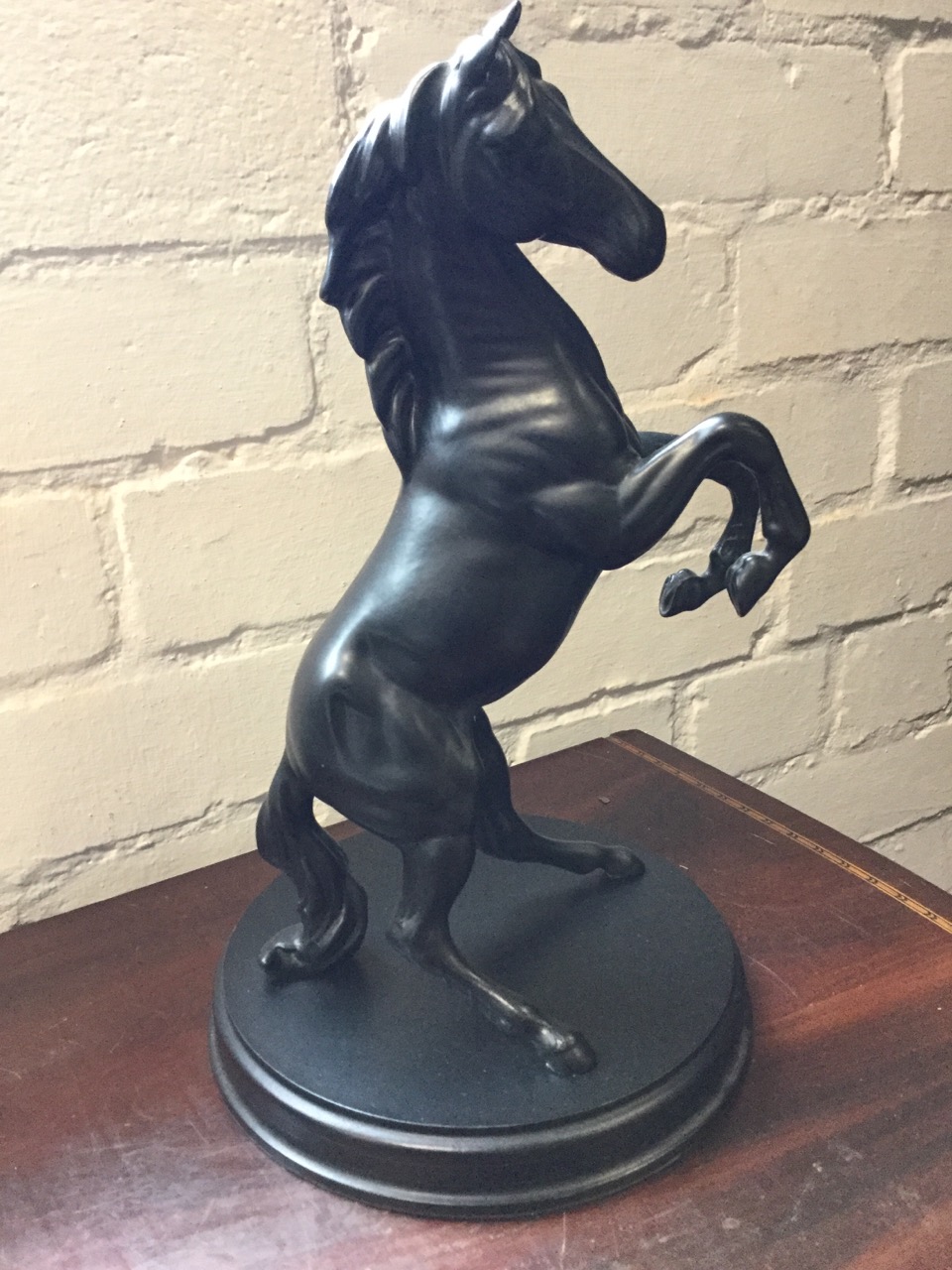 A Royal Doulton cast of a rearing horse on circular plinth; two resin cast Indian figures - - Image 2 of 3