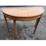 A nineteenth century D shaped satinwood hall table, the crossbanded top painted with foliate rose