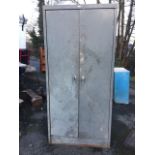 An Artmetal steel two door cabinet, having interior with shelves. (36.25in x 20in x 76.5in)