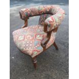 A Victorian upholstered oak captains chair, with button upholstery and sprung seat, the arms on