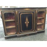 A late Victorian ebonised breakfront chiffonier with applied brass bead mounts, the central