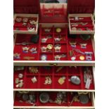 A jewellery box with two drawers containing miscellaneous earrings, cufflinks, brooches, a GPO
