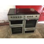 A Flavel electric range type cooker, having hotplates to top above two ovens, a grill cabinet and