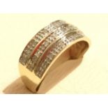 A 9ct yellow gold diamond eternity style ring, the diamonds set in three rows around a tapering