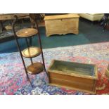 A three-tier Edwardian mahogany cakestand with circular folding platforms surmounted by turned