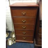 A Stag vanity unit, the moulded hinged top enclosing a dressing table mirror with small drawer and