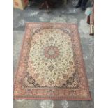 An oriental style Belgian Kasbah rug, woven with central floral medallion in foliage interlaced