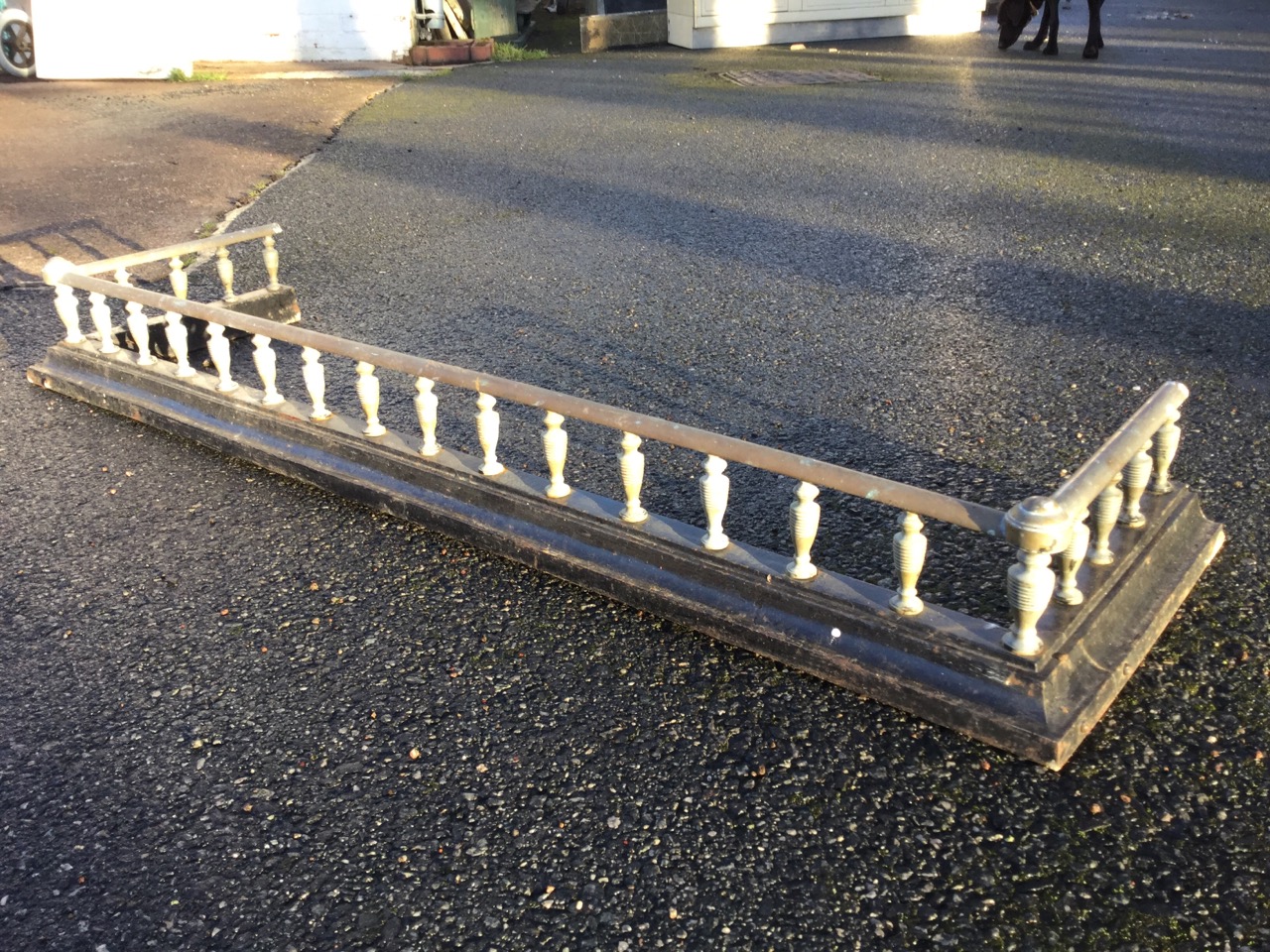 A Victorian brass and cast iron fender, with rows of ribbed gallery spindles supporting rail, raised - Image 3 of 3