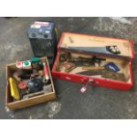 A rectangular painted toolbox and another drawer box with various woodworking tools - saws, a level,