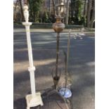 A Victorian brass art nouveau telescopic oil lamp stand with tendril scrolled feet; a painted wood