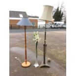 A brass Adams style standard lamp with telescopic column on base with festoon swags above triangular