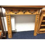 A nineteenth century pine chimneypiece, the mantleshelf above egg & dart moulding, having frieze and