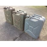 Three jerry cans of panelled construction having hinged caps, dated 1945, 1951 & 1952. (3)