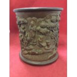 A Chinese carved hardwood pot, with moulded rim and foot, and raised on three feet, the sides of the