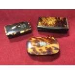 Three Victorian tortoiseshell mounted snuff boxes with moulded horn cases - two with foliate
