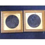 A pair of circular nineteenth century bronze classical plaques depicting mother & children, the