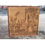 A framed Brussels tapestry woven with an Egyptian streetscene with figures, donkey & camel outside