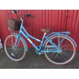 A Cross vintage style heritage range Lotti bicycle with sprung seat, pannier rack, chain guard,