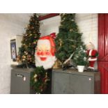 A quantity of Christmas decorations including two trees, a giant lighting up Santa head, tinsel,