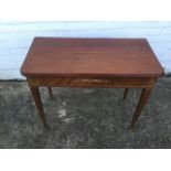 A nineteenth century European mahogany turn-over-top tea table, the rectangular rounded top