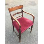 A nineteenth century mahogany elbow chair, with rectangular tablet moulded back above a leaf