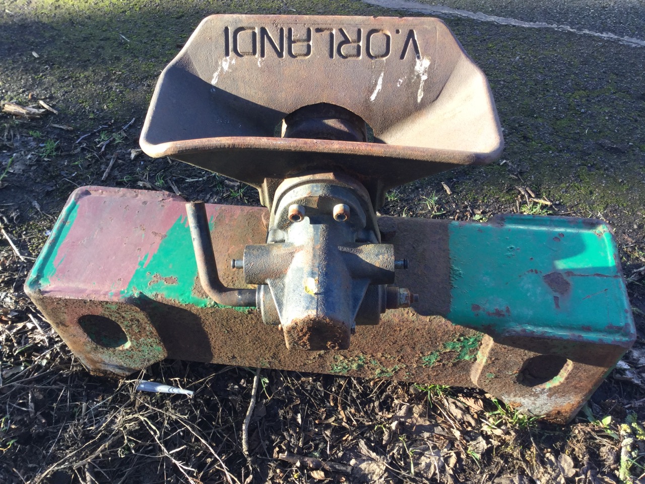 A heavy cast iron Orlandi tractor trailer hitch.